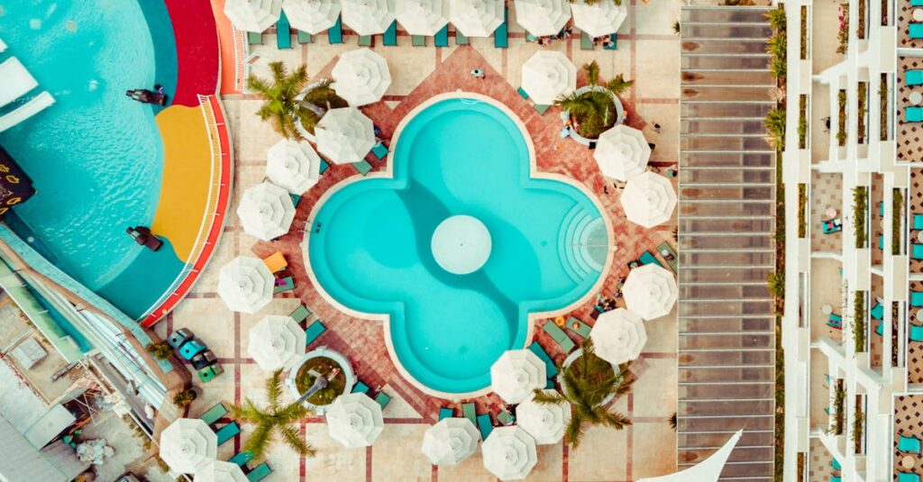 Stunning aerial photo of a colorful resort pool in Cancún, Mexico, showcasing vibrant design.